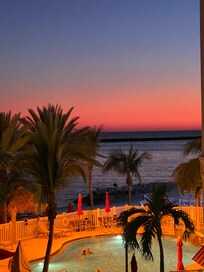 View from balcony on 3rd floor during sunset.