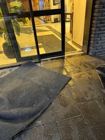 Water all over the entrance and lobby