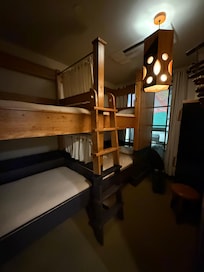A quad room: 2 sets of bunk beds and a shared bathroom in the room