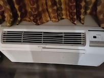 air conditioner looked like it had fought in at least three dust storms and lost every time. I half-expected it to cough.