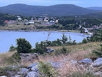 Looking out into the cove from the adjacent meadow