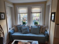 Comfy couch with fun decor. Swinging chair is fun!