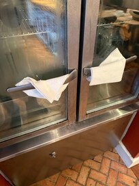 Fridge handles had accumulation of food on back side,