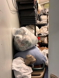 This is a linen closet with wires hanging down in it. Definite fire hazard. Rodent infestation was definitely present. Gross.