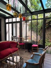 Behind the reception is a small sitting area and garden.