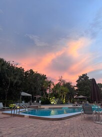 Outdoor pool view at sunset