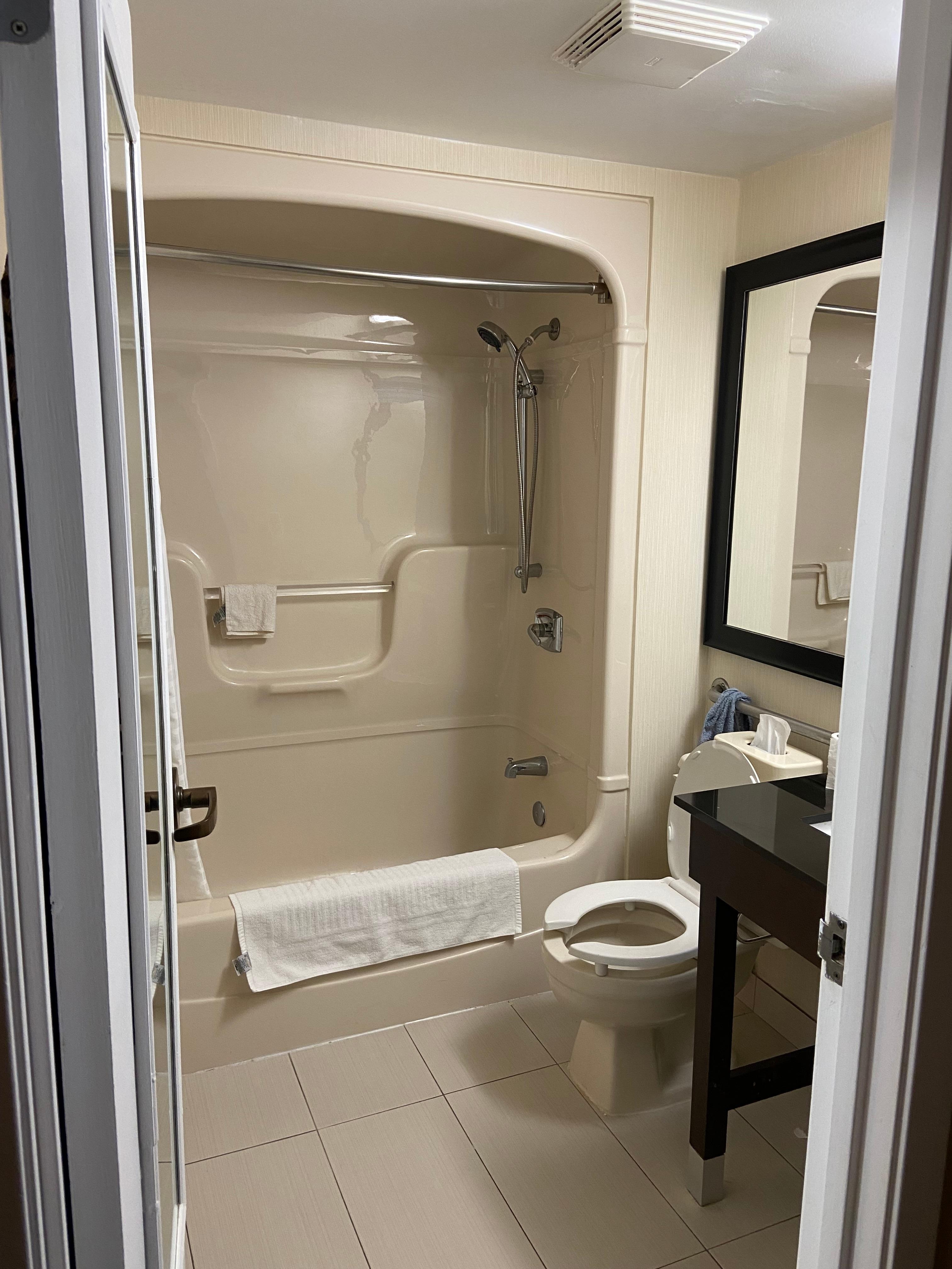 Nice and clean. They provide bottles of shampoo, conditioner and lotion all connected to the wall. I like the idea that they have height adjustable hand held shower head. Plenty of hot water 