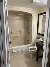 Nice and clean. They provide bottles of shampoo, conditioner and lotion all connected to the wall. I like the idea that they have height adjustable hand held shower head. Plenty of hot water