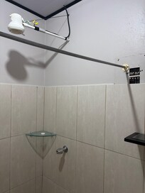 Electric panel beside shower with no temp control