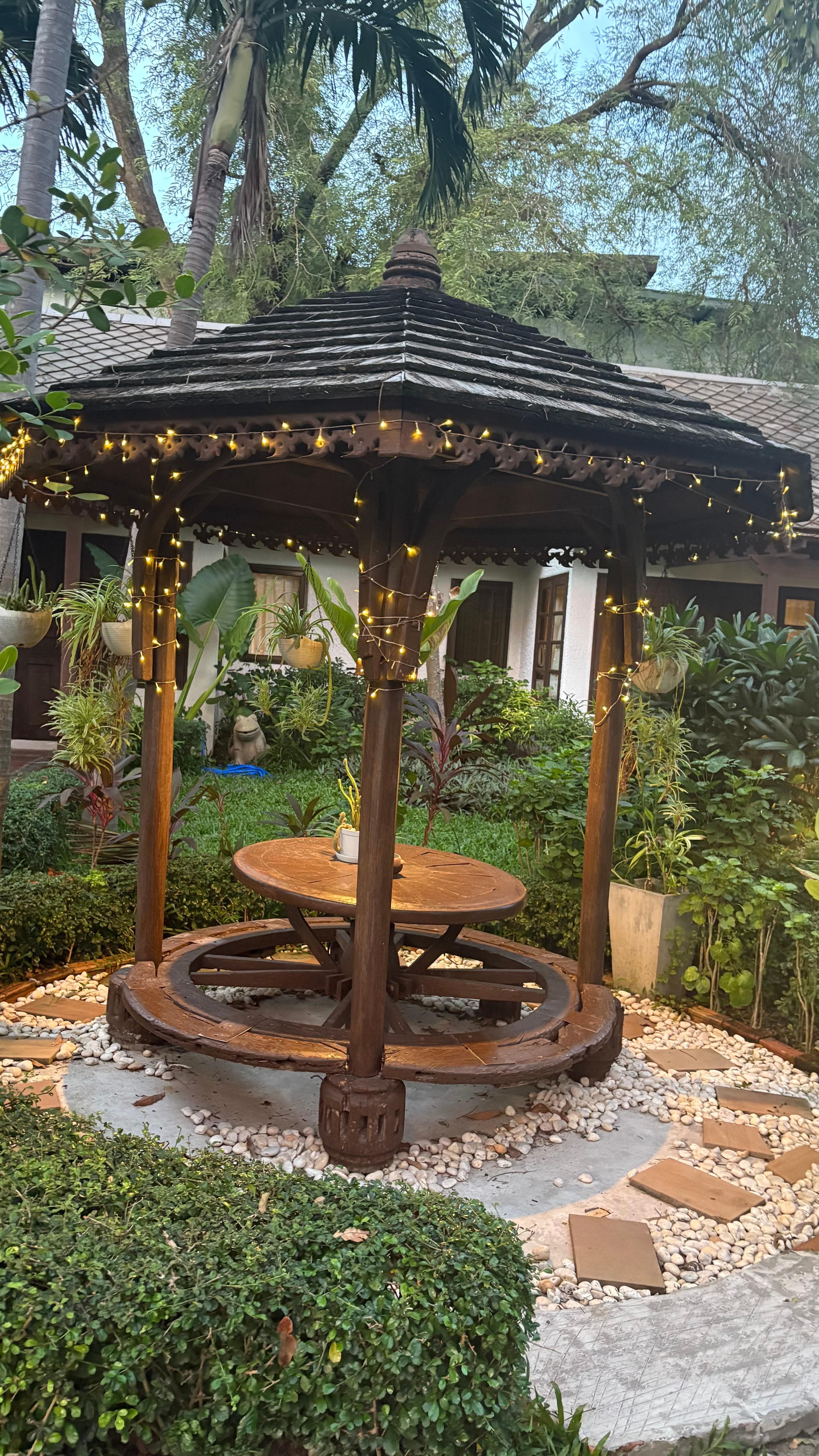 A place to rest in the middle of the Garden , on the way to the restaurant , pool and bar 