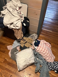 Clothes on the floor and couch