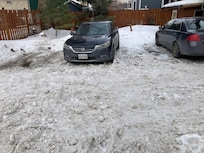 The space between these cars is too narrow to park