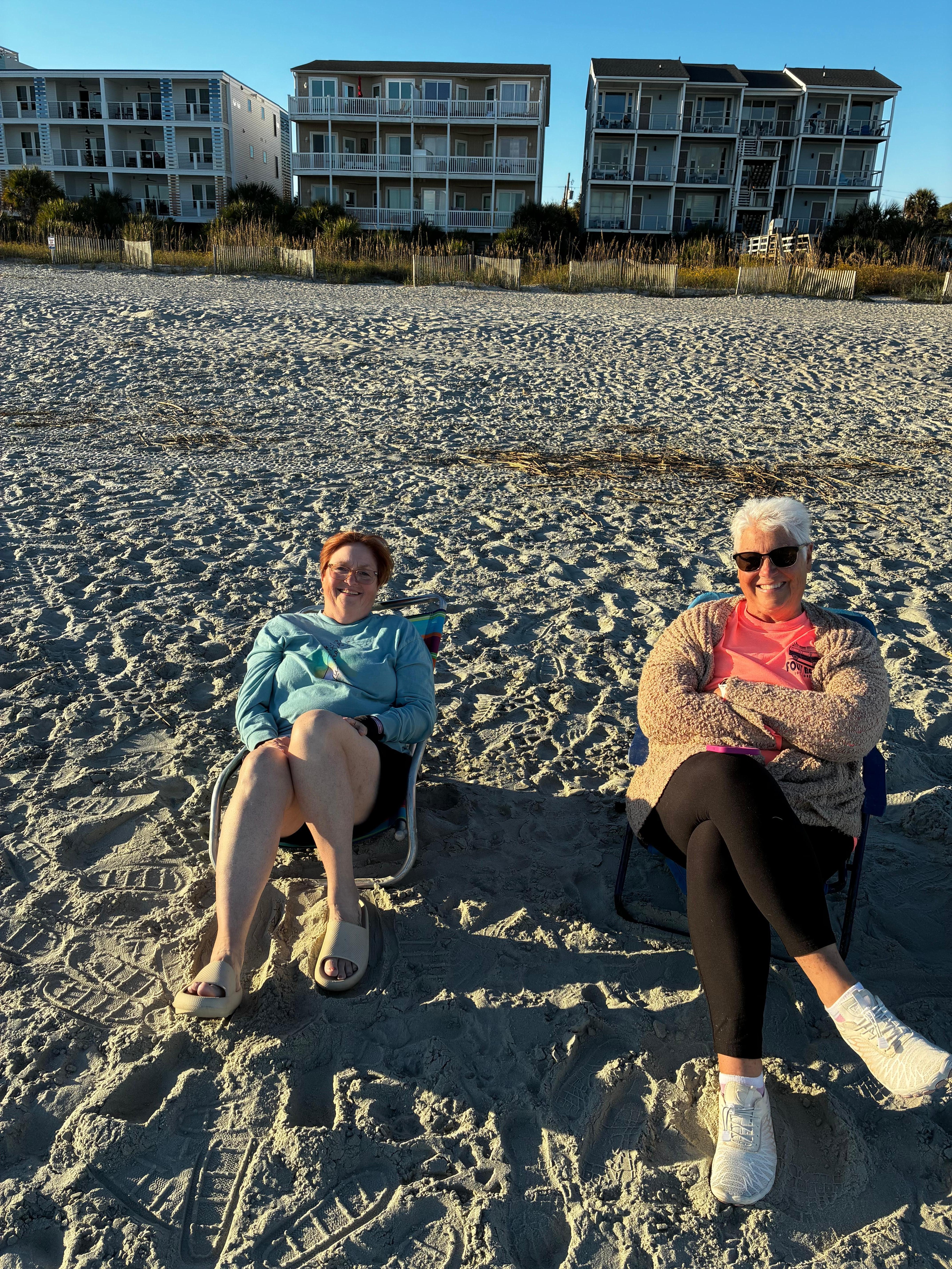 Enjoying the beach with condo in the background 