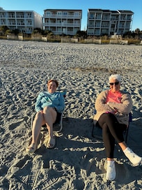 Enjoying the beach with condo in the background