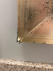 All the corners of the mirror were rusty and cracked