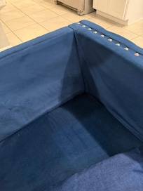 Living room chair with no back cushion. Back hit wood when seated.