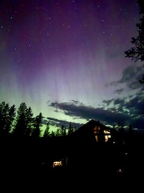 The host texted an App alert and saw the Northern Lights from the driveway!