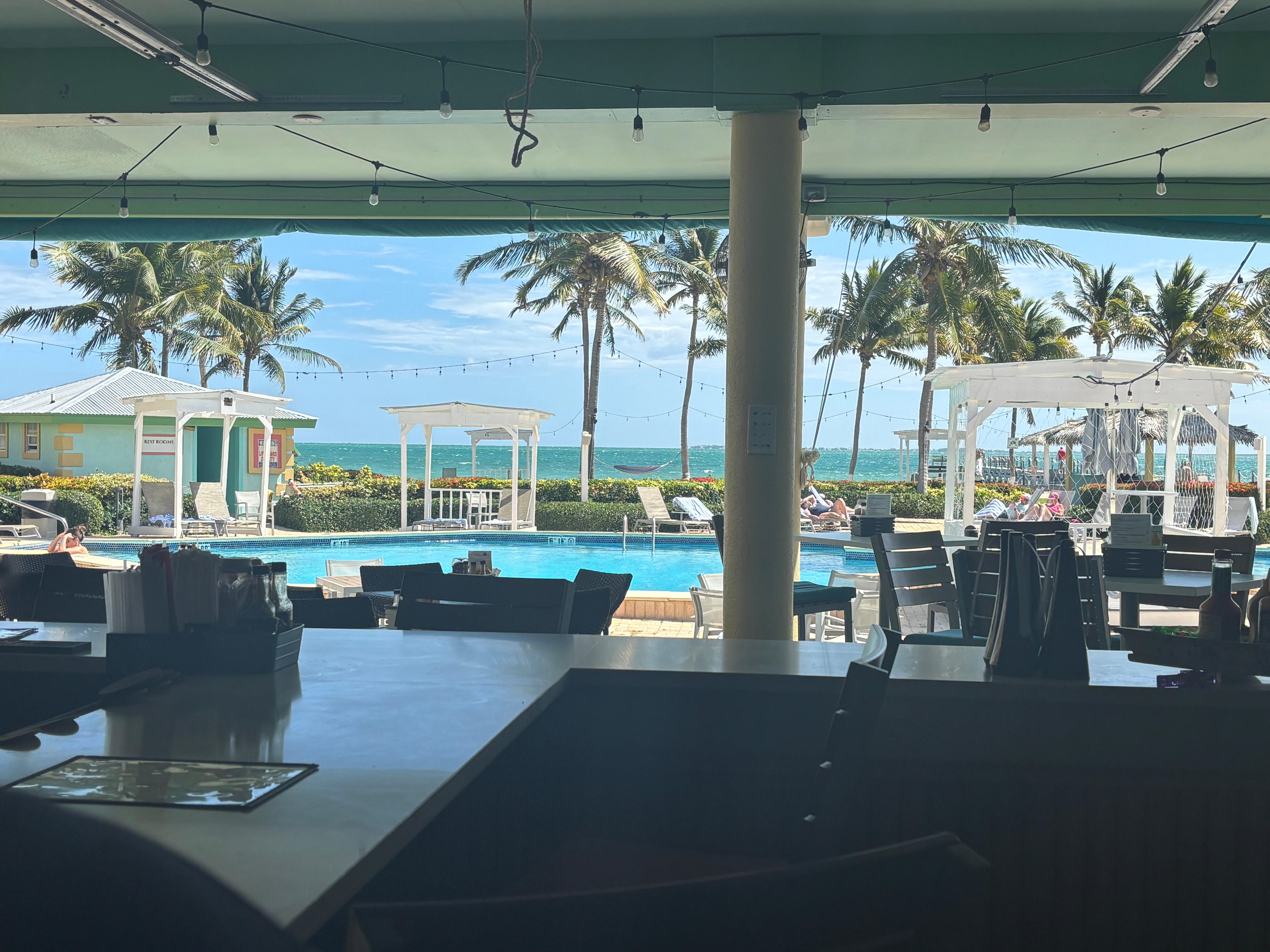 View of pool & ocean from restaurant bar
