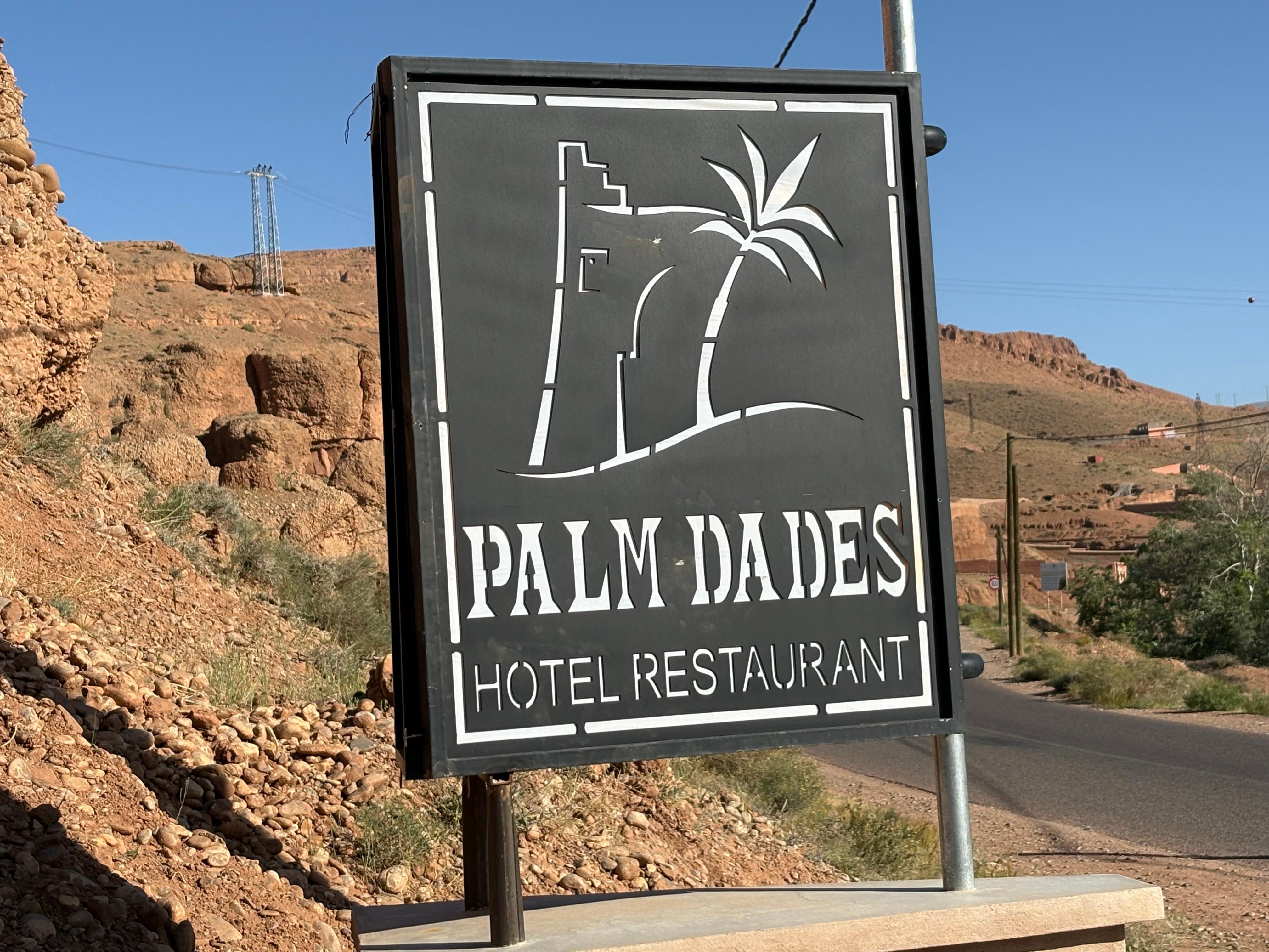 The hotel sign at street