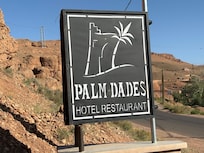 The hotel sign at street