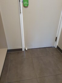 Gap round edge of door, letting light through