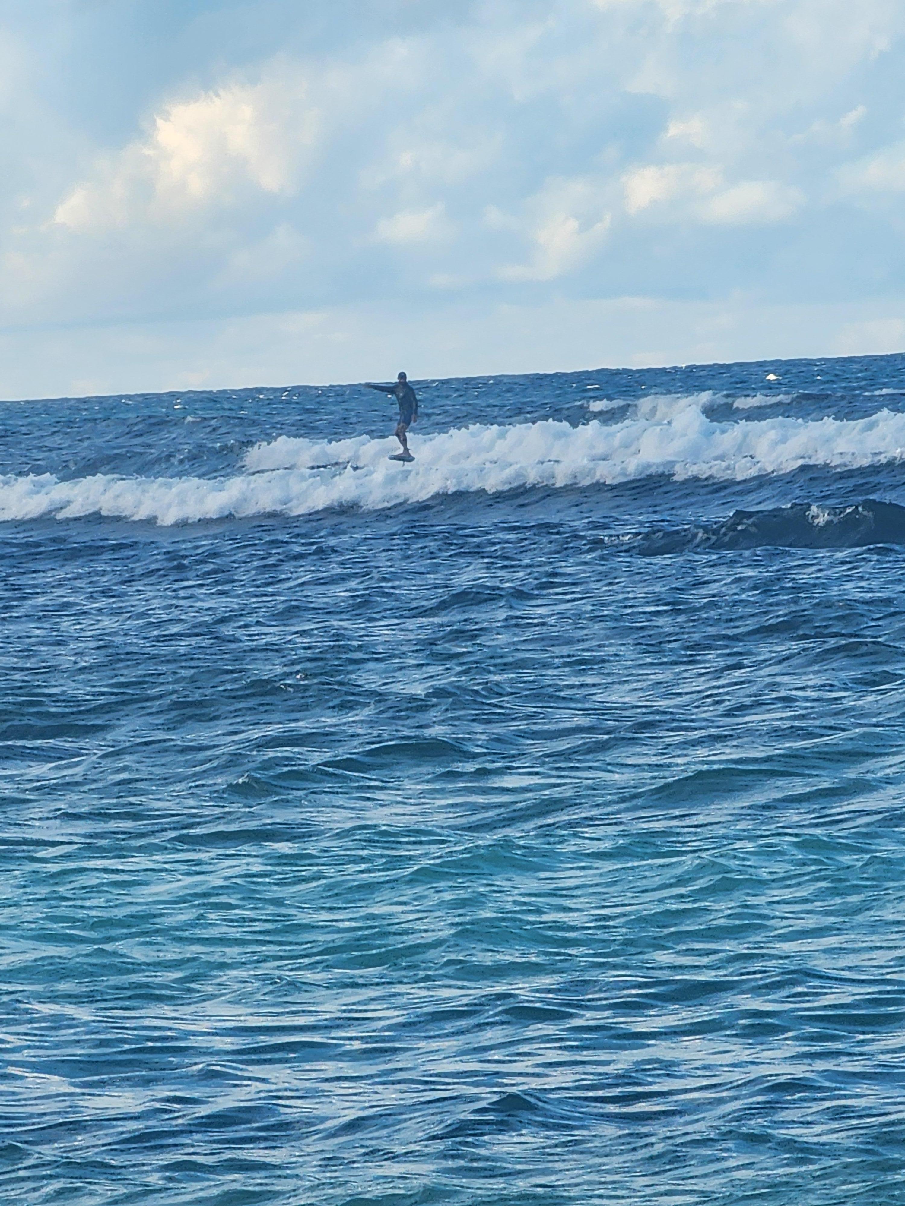 Surfer on elevated surfboard