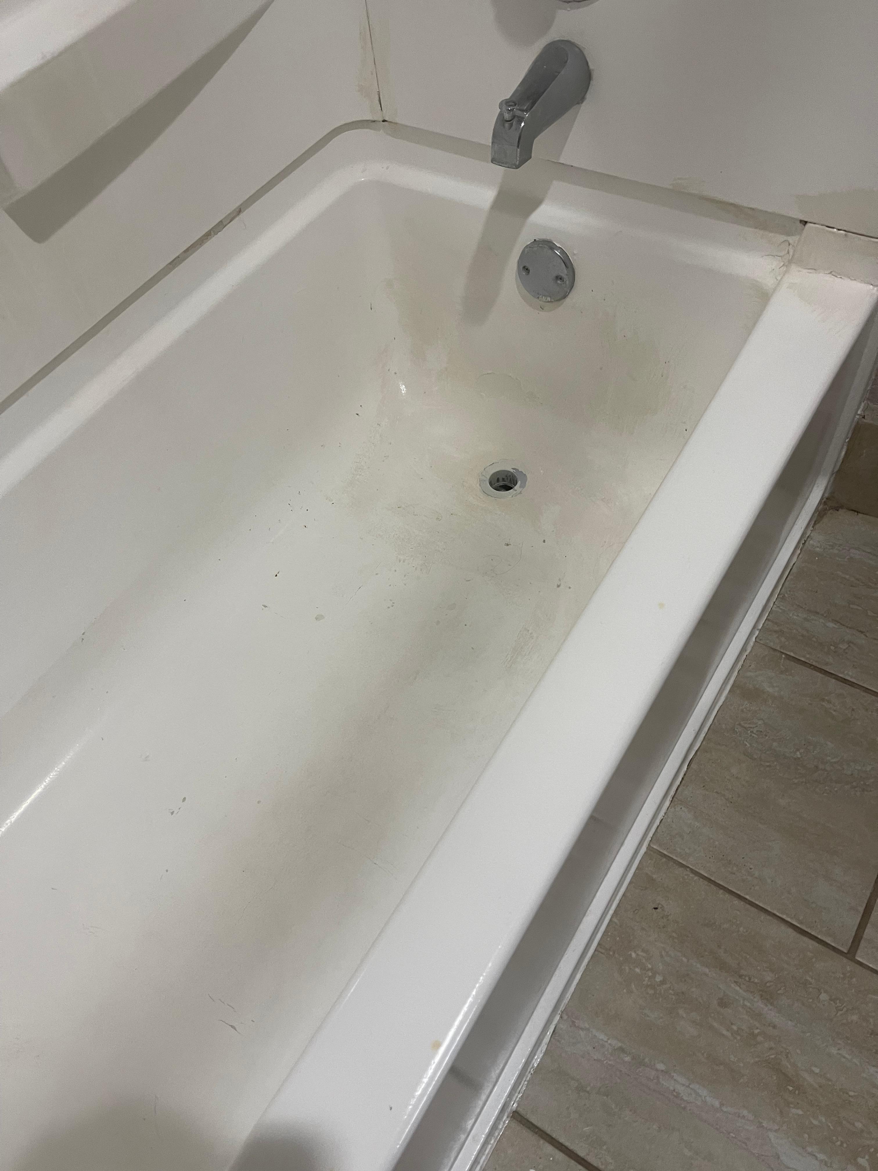 Stained, dirty tub. 