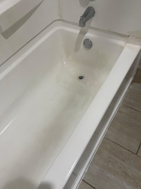 Stained, dirty tub.