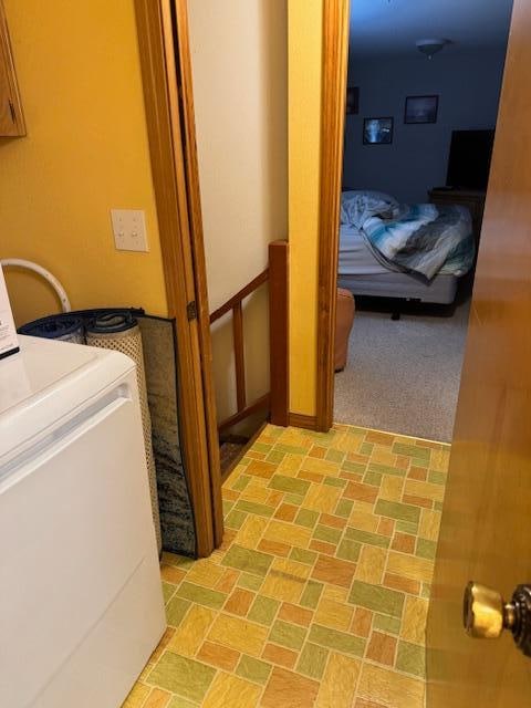 View from half bath, which is also the laundry room, showing no door to garage