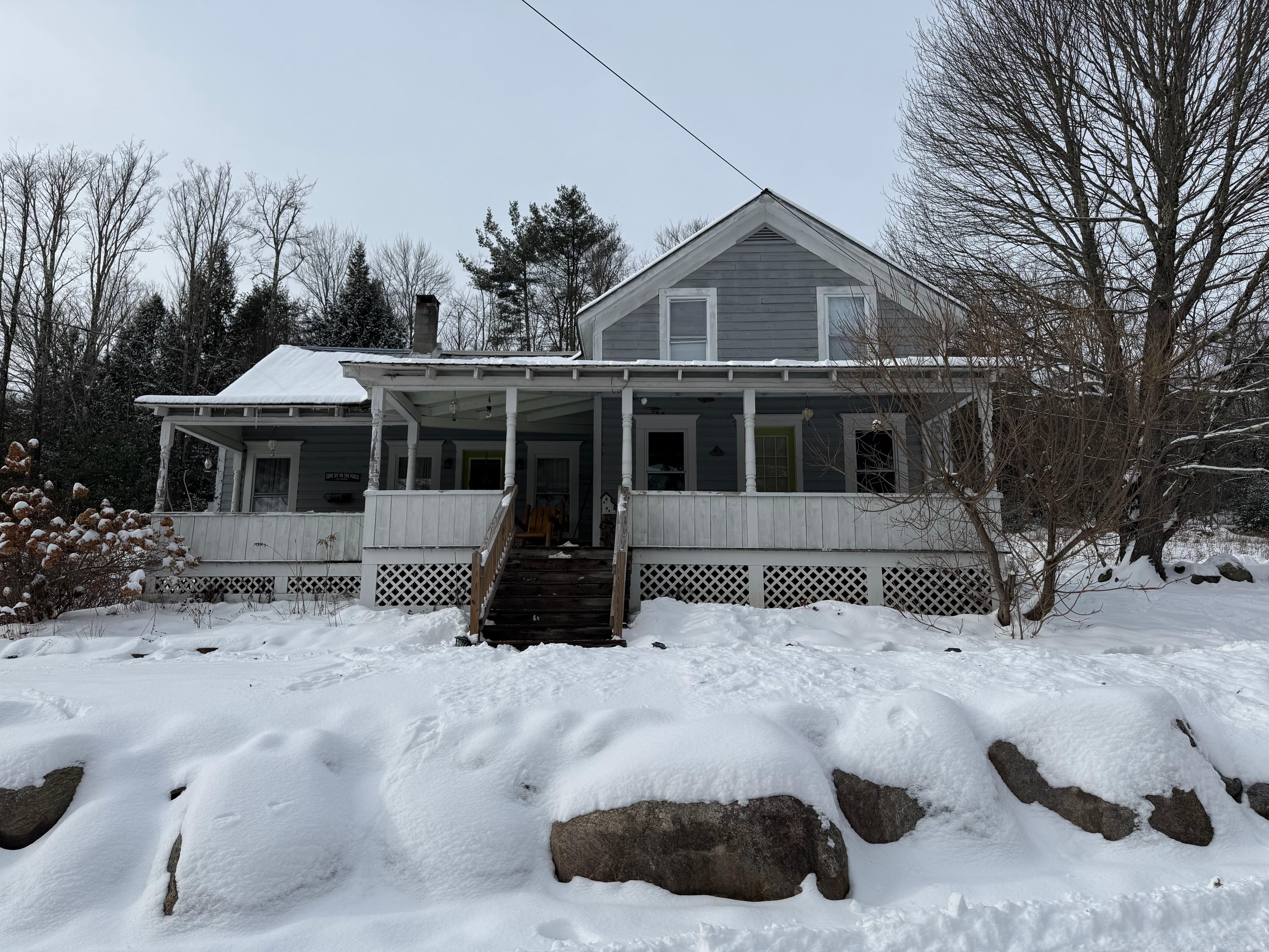 The front of Bluebear Cottage with fresh snow