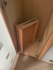 Broken draw shoved in wardrobe