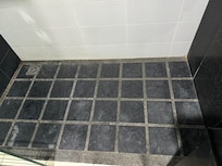 Floor looks greasy, hasn’t been scrubbed for a while.