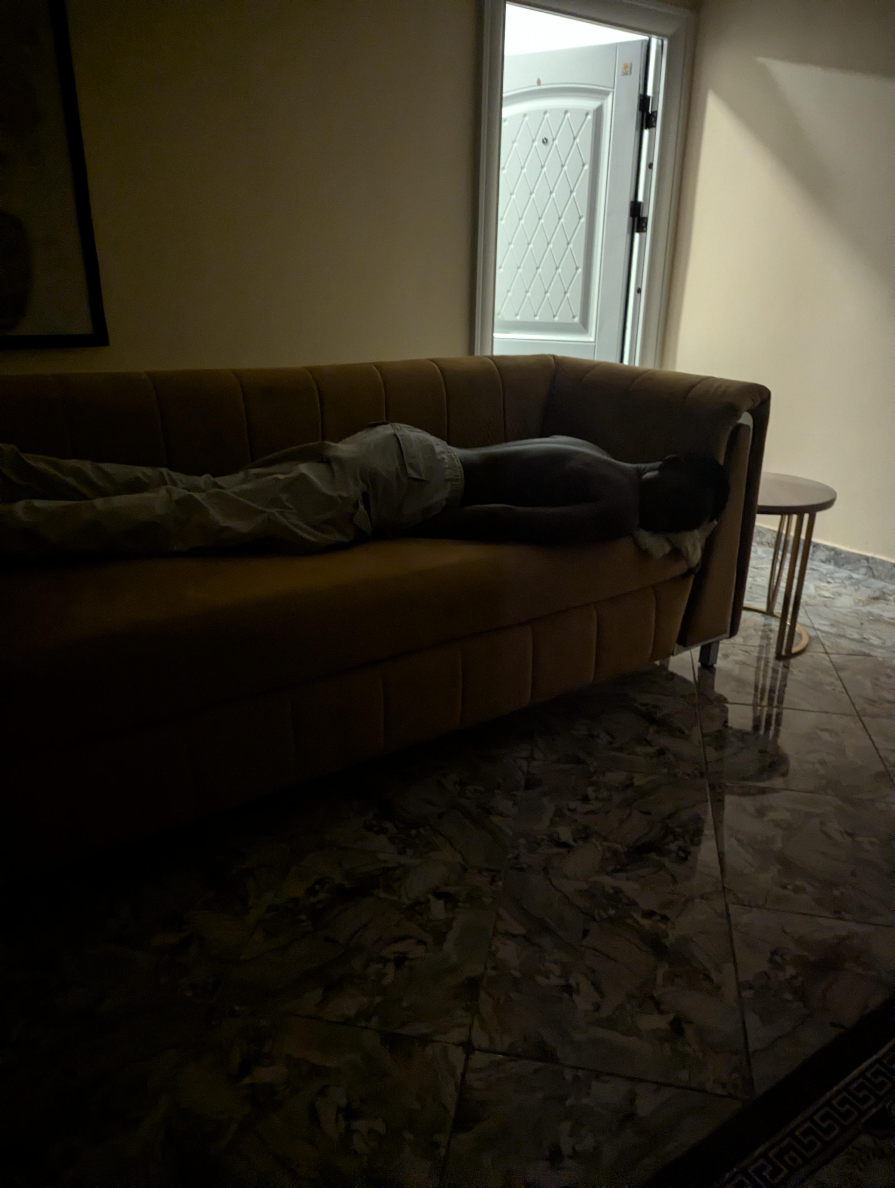 My husband laying on couch and wasn't offered my covers