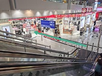Turn left to the cosmetics shop, but do not go into the shop.