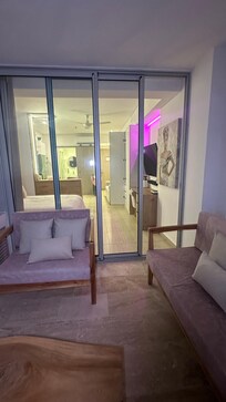 Kitchen area with all you need including clean water in fridge and bar to sit and eat