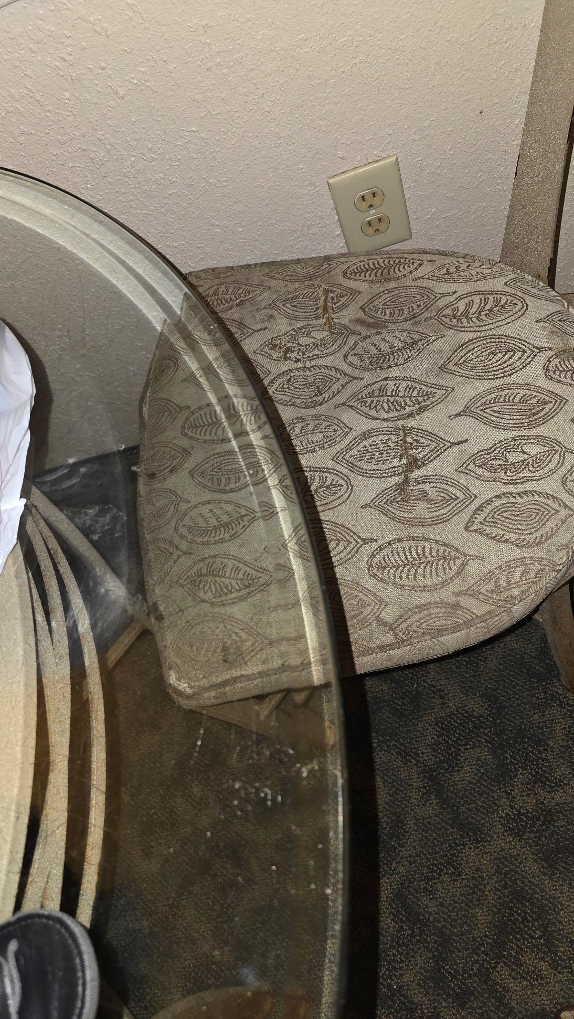 Dining room chairs were torn, worn and not clean.