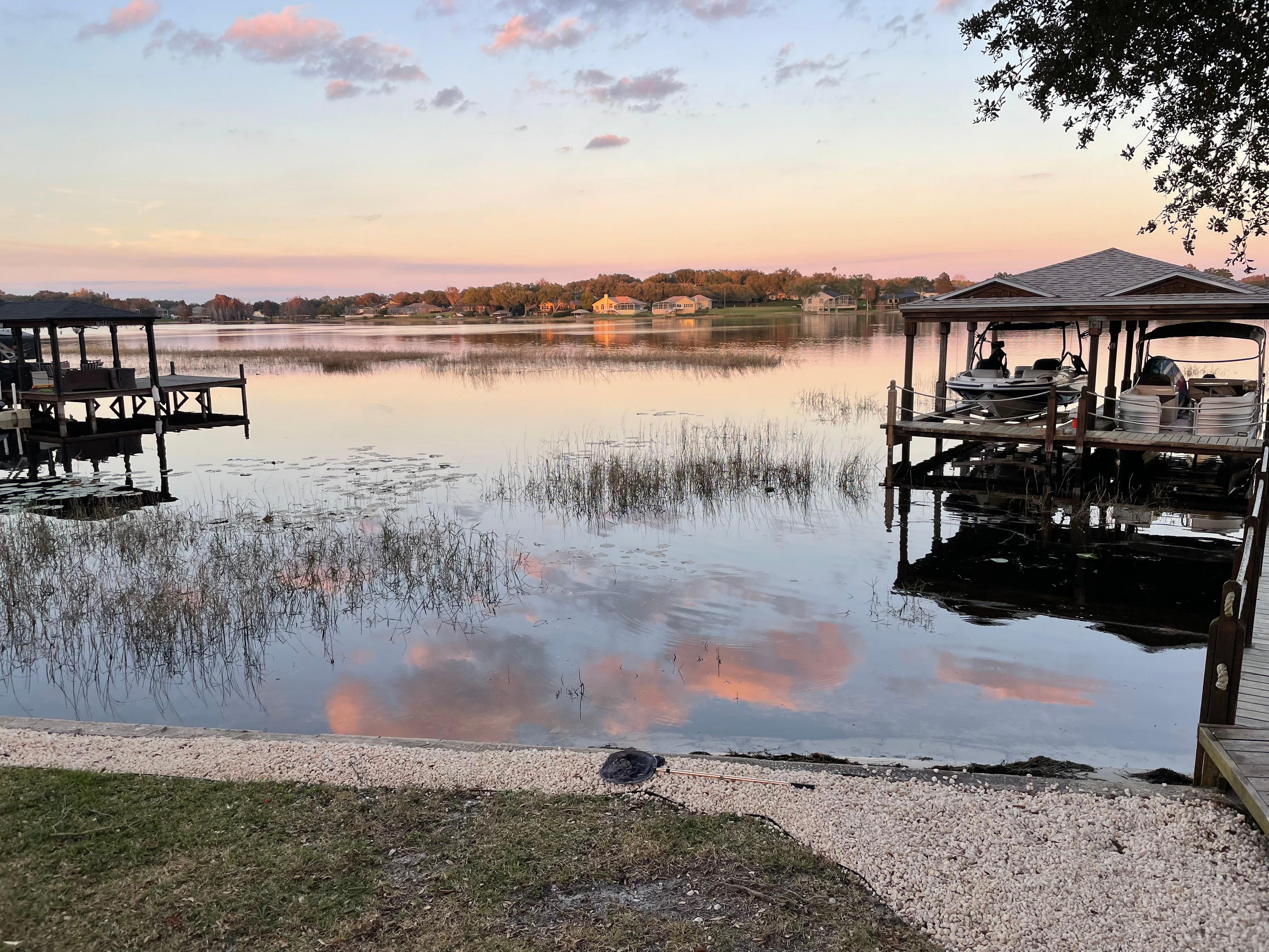 Sunset over the lake, viewed from the beautiful backyard. There are so many places to sit and enjoy the view and being with your family/friends!