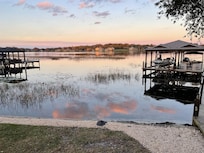 Sunset over the lake, viewed from the beautiful backyard. There are so many places to sit and enjoy the view and being with your family/friends!