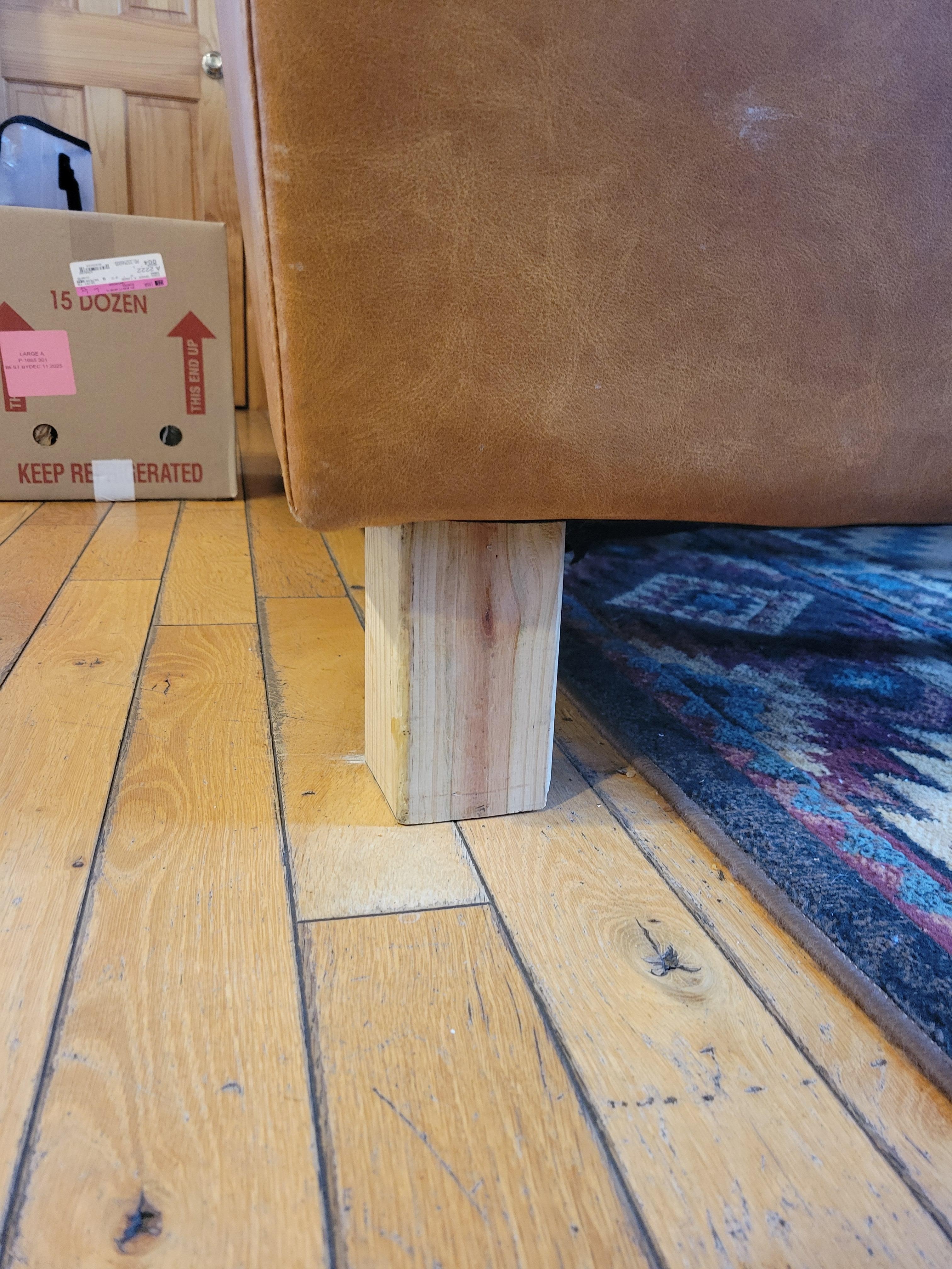 Furniture propped up on wood blocks (unattached) as mentioned 7 months prior in another review.