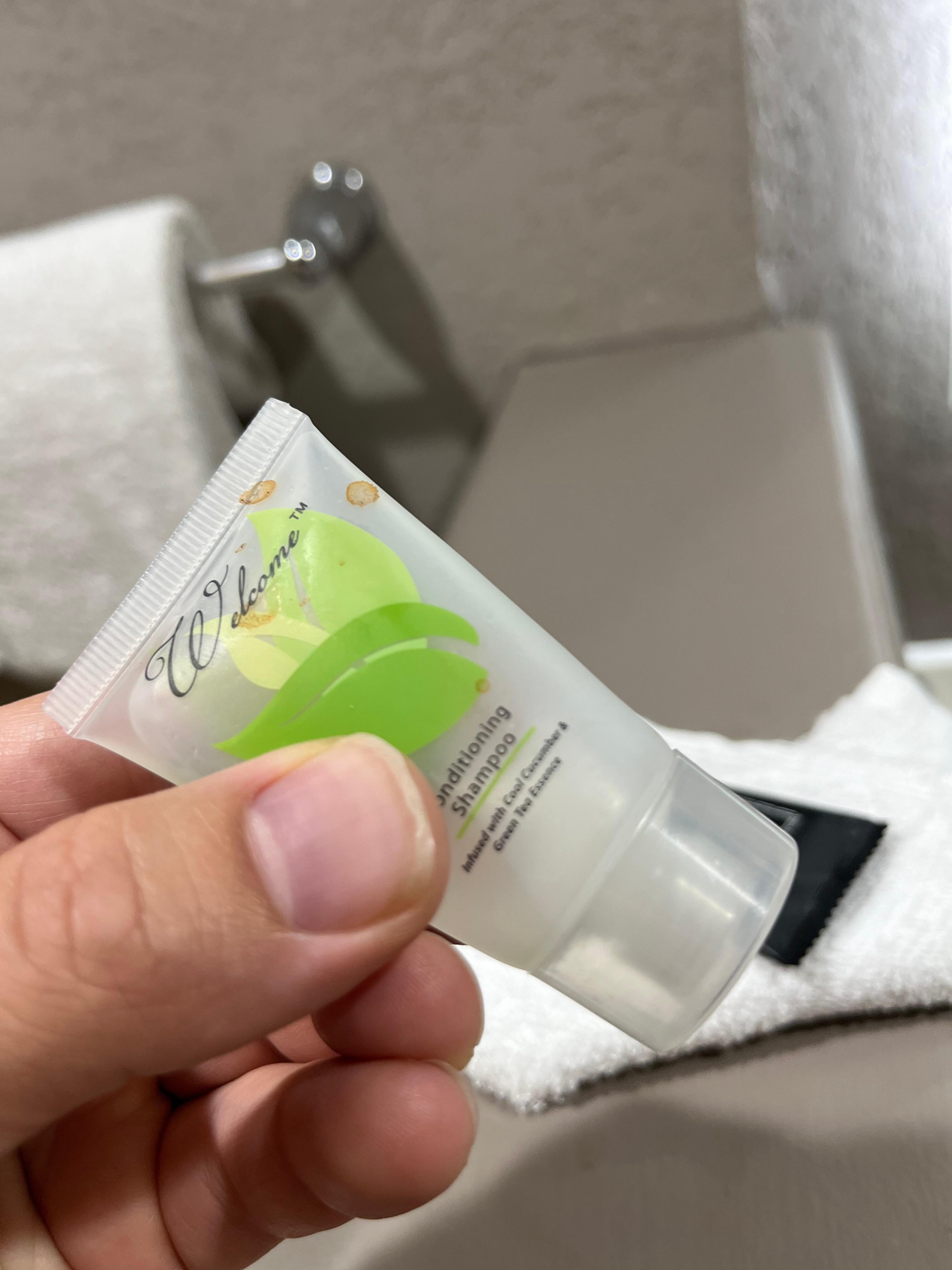 Empty/dirty provided shampoo bottle.