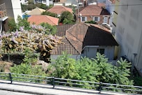 View directly across the street - still, some standard houses set up after the 1953 earthquake can be recognized despite extensions and makeovers