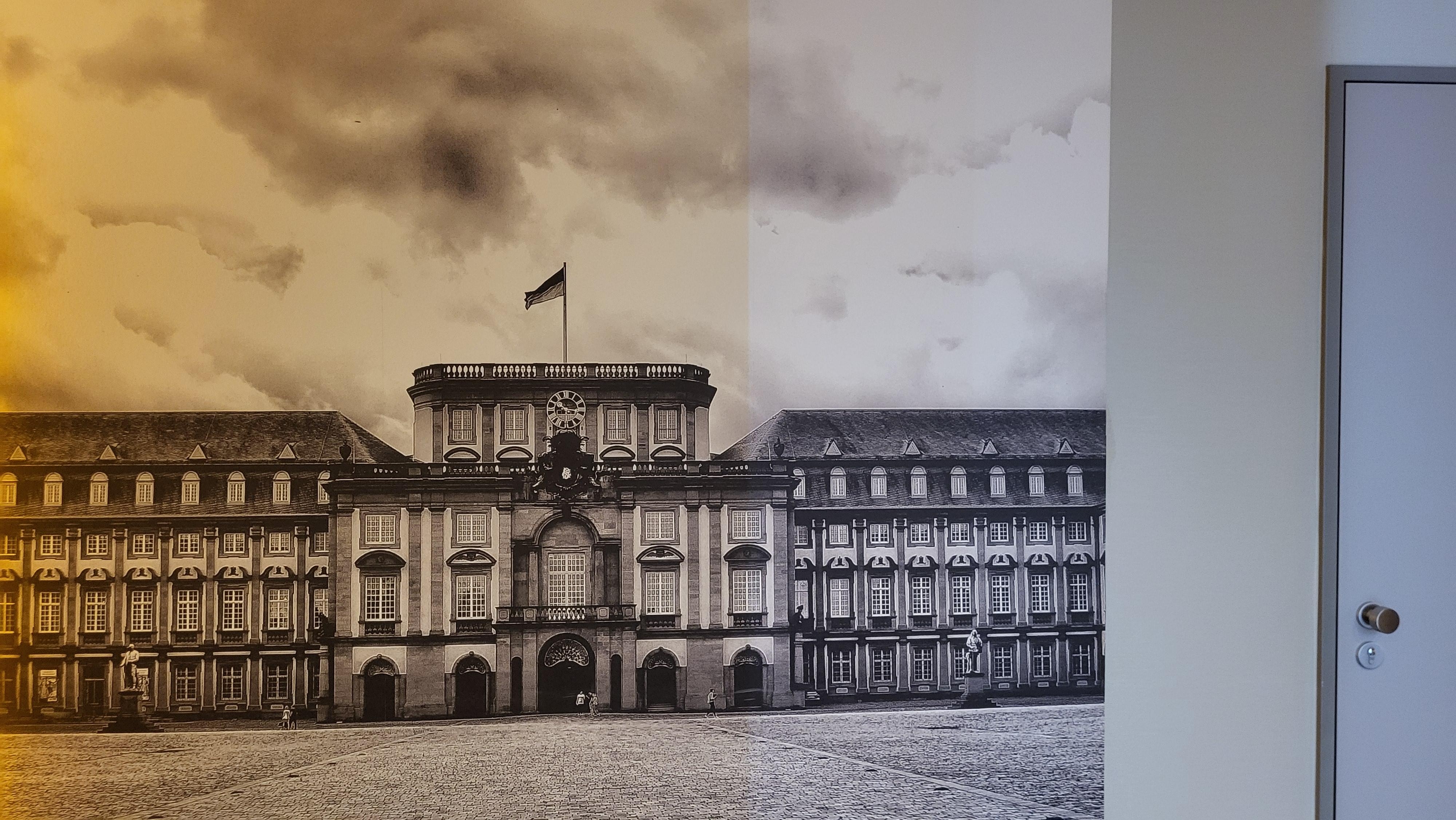 Across from the elevator