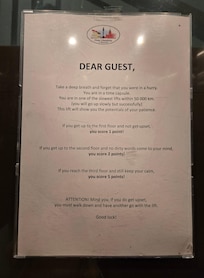 The warning posted in the elevator. Slow but it will get you there