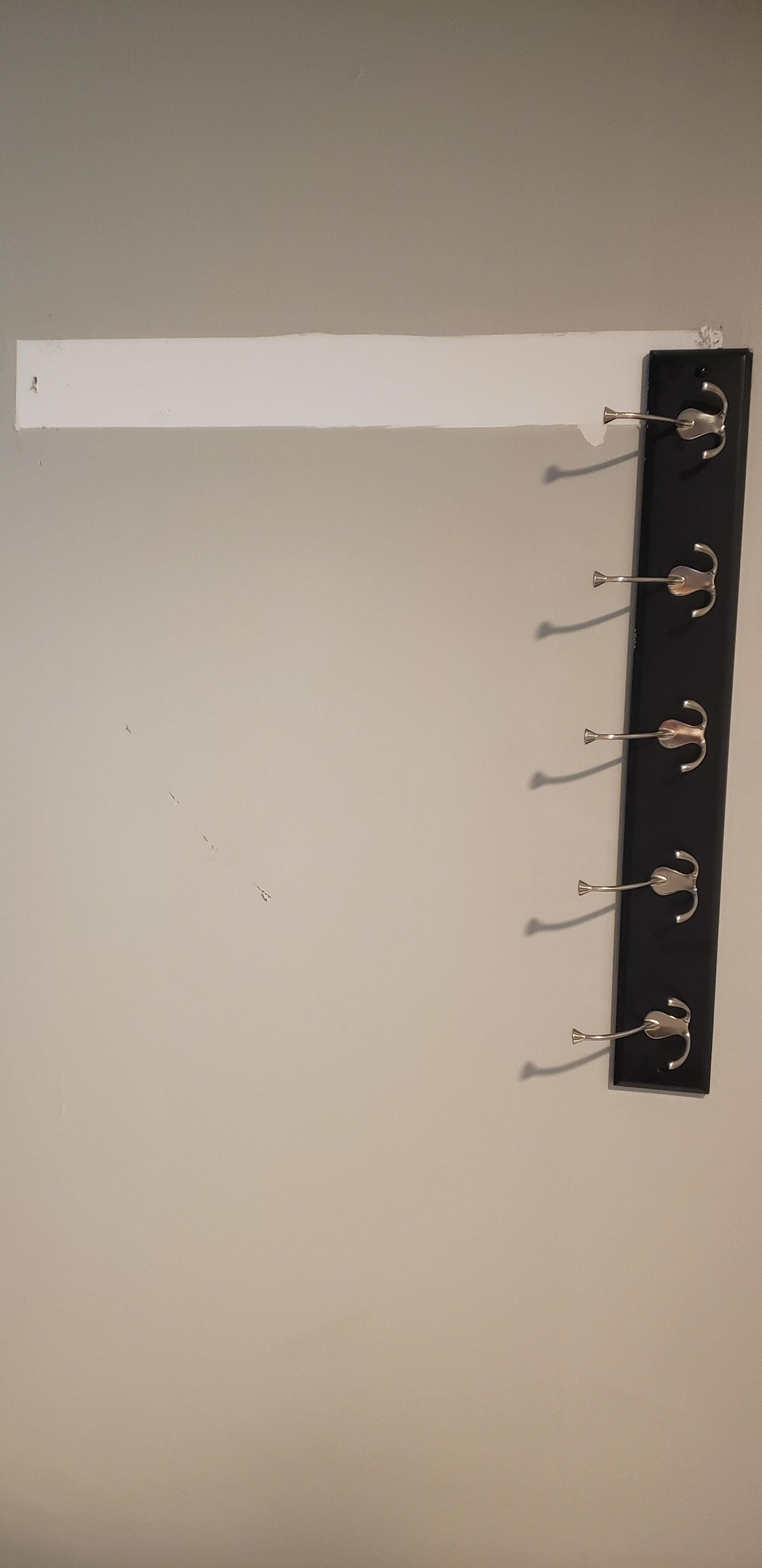 The towel rack was hanging on by a nail. They never fixed it.