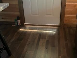 Gap at the front door which is wide enough to let a whole host of critters in (a wasp on our stay). 