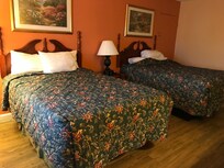 2 double beds. Off ri far right, there was a door that joined the neighboring room.