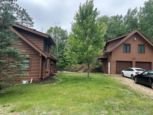 Main lodge on left, guest house on upper floor above garage