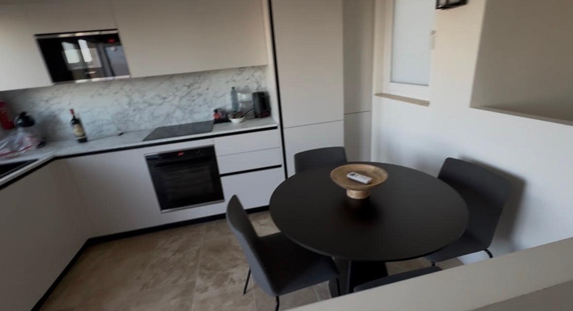 Kitchen upstairs, next to terrace.