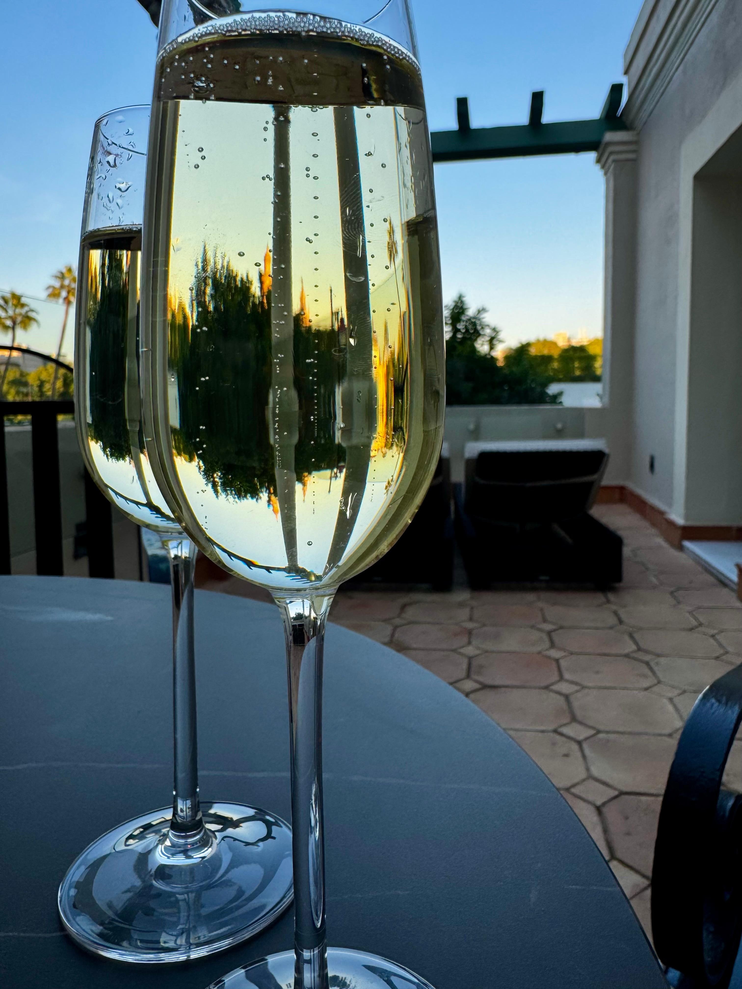 Cava on our outdoor patio overlooking the golden tower and river