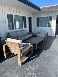 Th patio that is shared with unit 741 and 743. There is a grill on the patio as well.